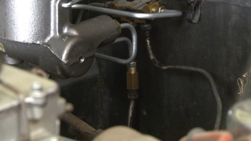 A close up of the new rear brake line after being connected to the union