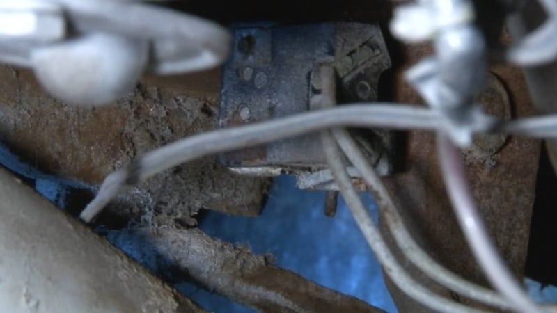 A close up of a fully reconnected pushrod and brake pedal