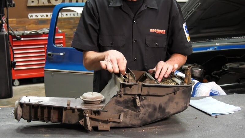 Inspecting the internal components and vacuum actuator of a classic Chevy or GMC truck heater box
