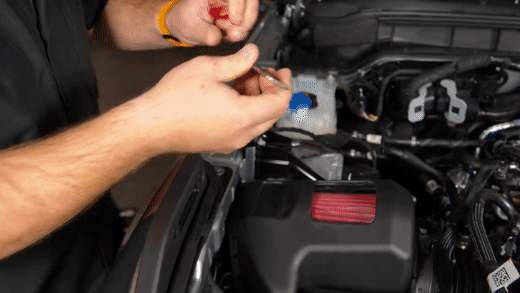 Installing badge into Roush intake lid inlet