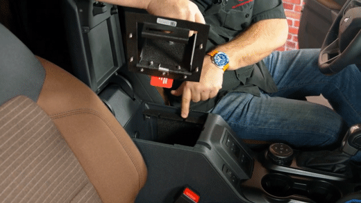 Setting Roush vault top plate into center console vault frame