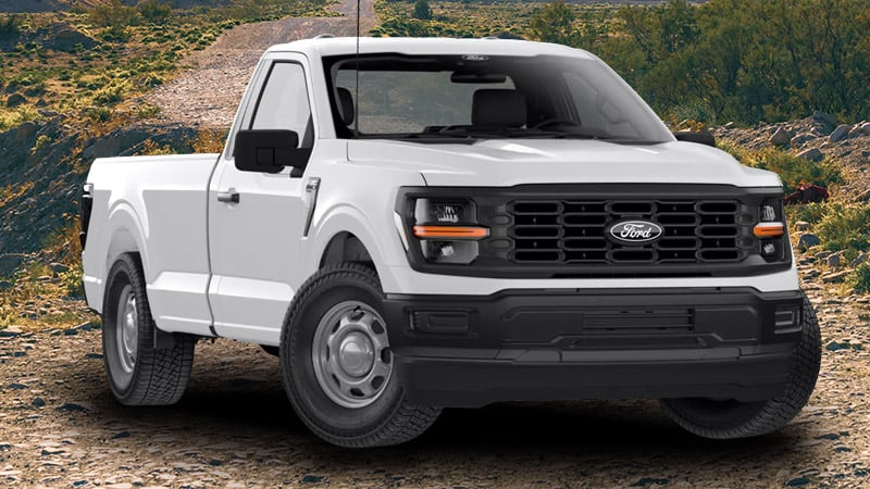 A bright white metallic Ford F150 truck