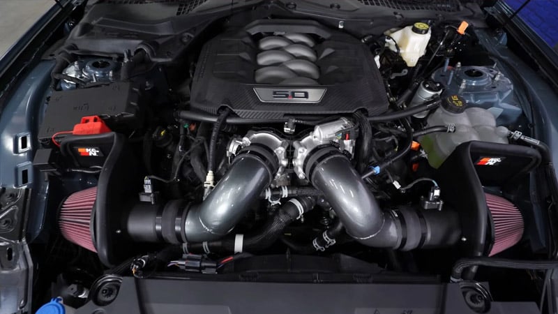 A close up of the engine bay of an S650 Mustang
