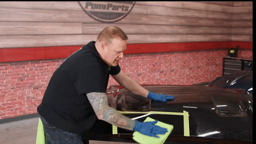 Wiping excess ceramic coating off a mustang hood