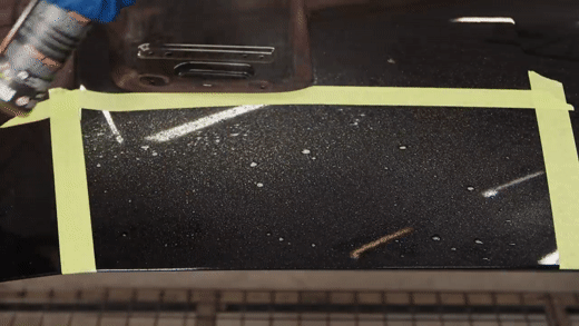 Decontaminating a black Mustang hood with an iron decontaminant