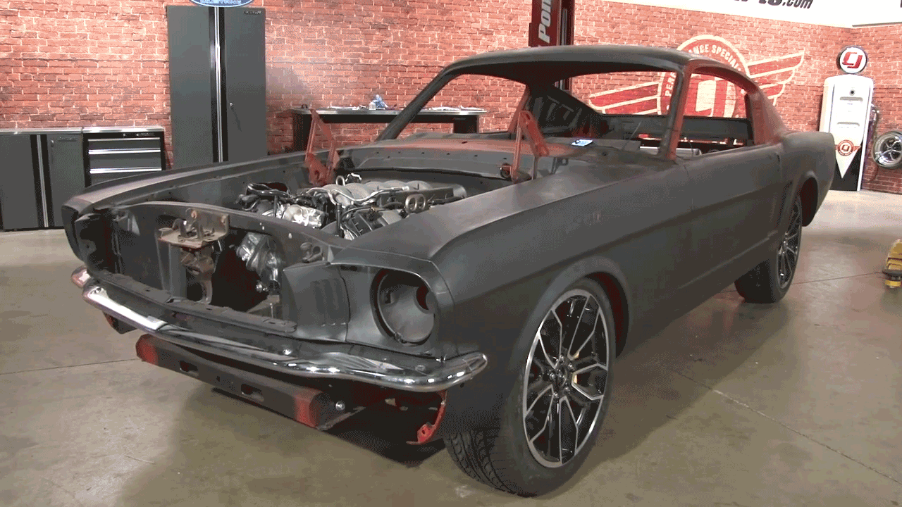 A gif of a classic Mustang going up and down on air ride suspension