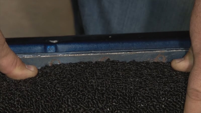 Carpet is snugly pulled to the door sill