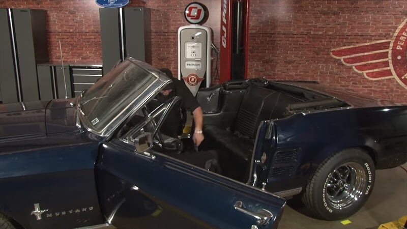 Bill places front seats back in place