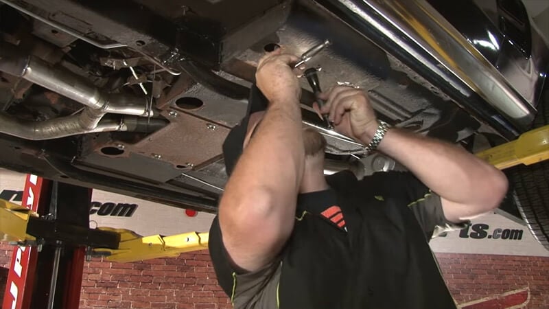 Bill uses socket wrench to undo nuts