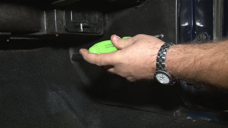 Removing screw from the kick panel