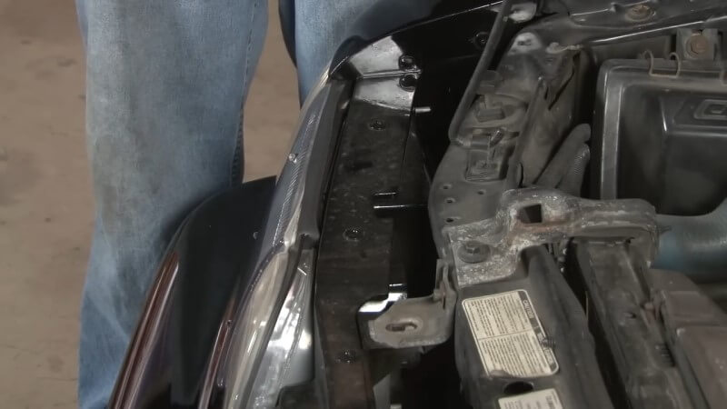 A close up of a Fox Body Mustang headlight before removal