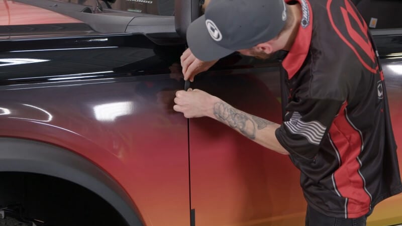Inserting door and fender protectors on a modern Bronco