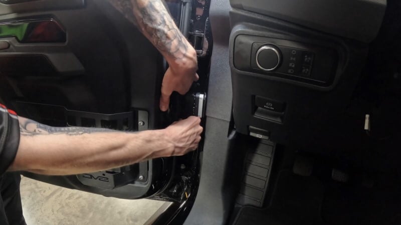 Disconnecting the door wiring harness on a modern Bronco