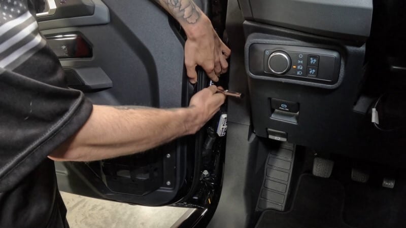 Removing top and lower door hinge bolts