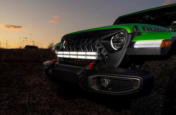 Bright LED light bar mounted in the center of a Jeep’s grille
