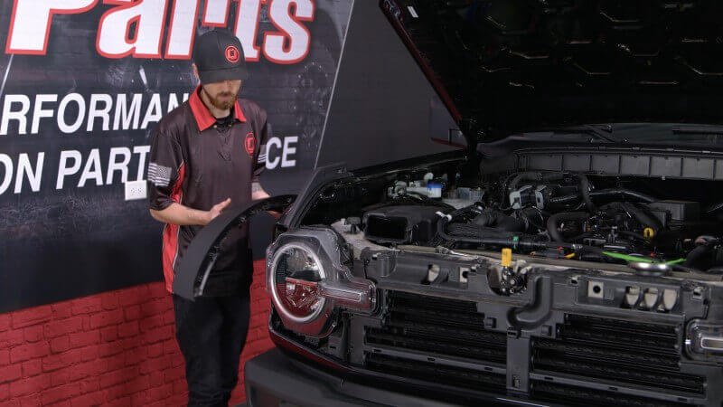 Mechanic removing the fender flares on a 2021 Ford Bronco