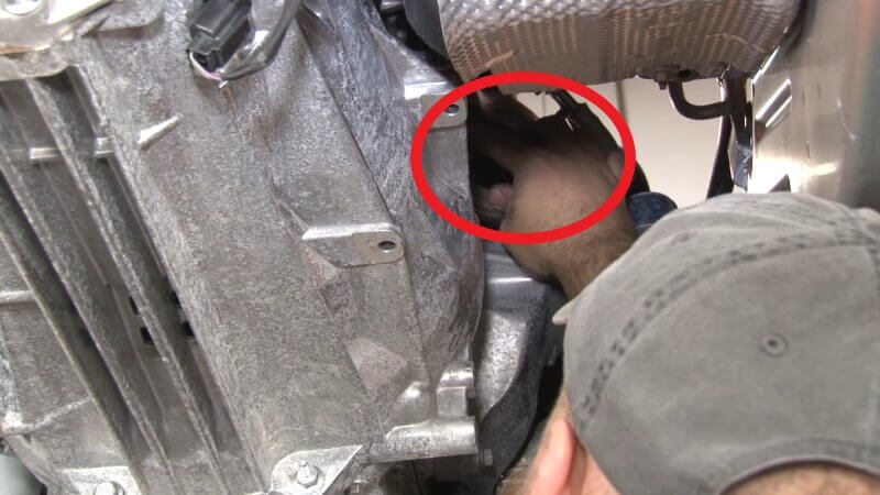 Mechanic installing the stock turbo gasket on a Mustang EcoBoost