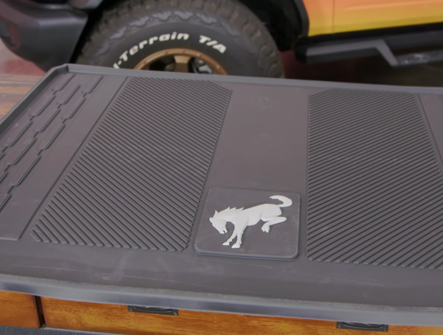 A Bronco cargo mat laid out on a table