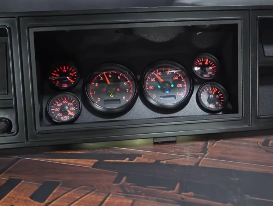 Restomod Bronco gauges on a wooden table