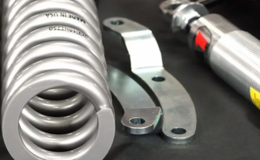 A coil spring and shock absorber on a table